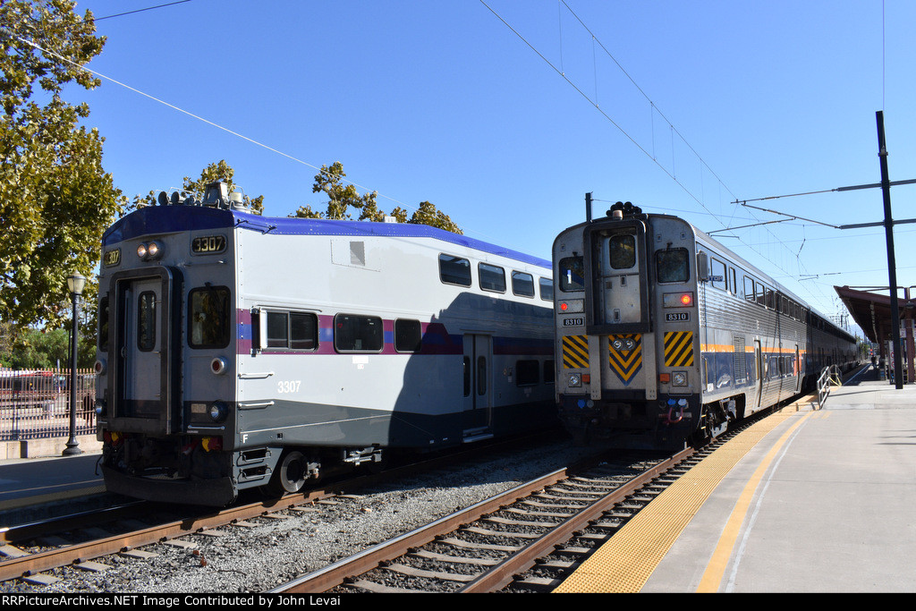 The first outbound Coaster Train of the day awaiting departure from San Jose Diridon Station while an Amtrak Capitol Corridor train awaits its assignment